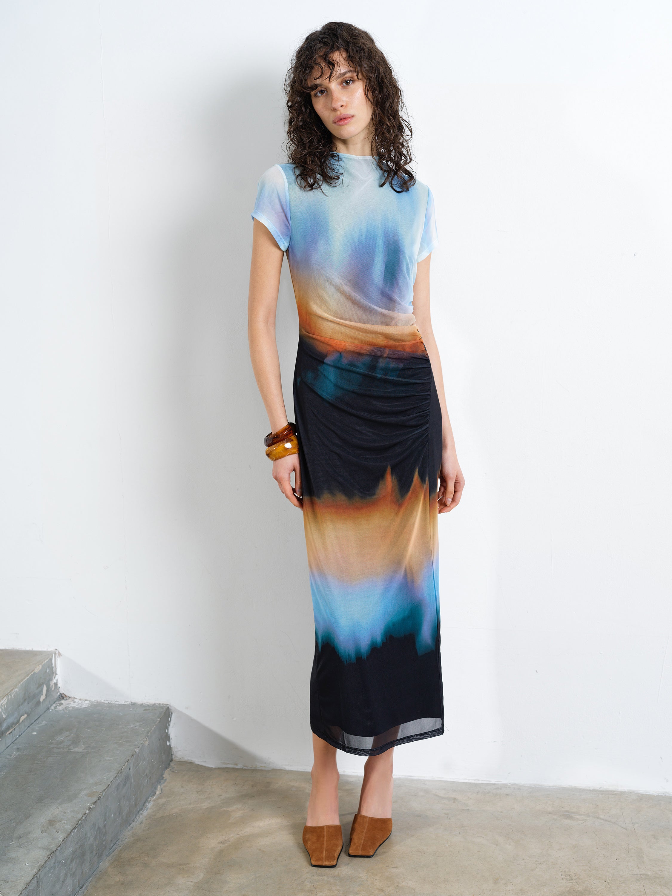 Woman wearing a multi-coloured mesh ombre short sleeve midi dress