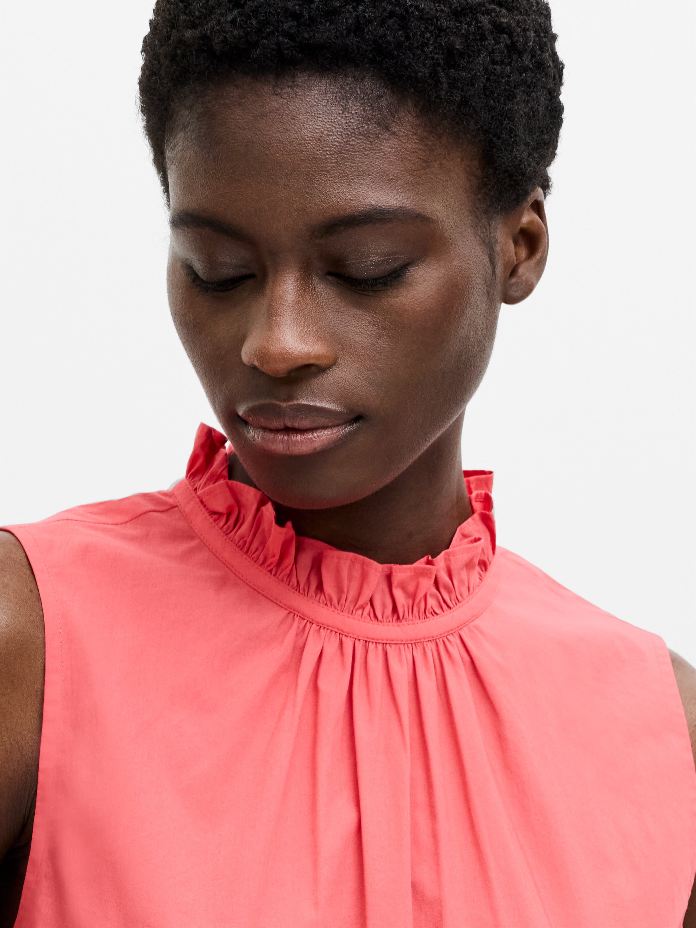 High Neck Broderie Hem Peplum Top